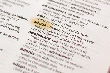 Ivanovsk, Russia - November 19, 2018: The word or phrase Adobe in a dictionary.