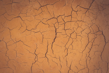 Wall background made clay mold clay into a residential home.