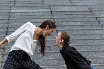 Two Women Screaming at Each Other Face to Face