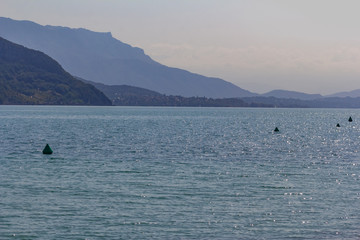 Beautiful summer landscape: blue lake surrounded by mountains, sunny day, France, Lac du Bourget