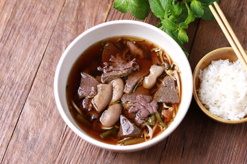  Close up shot of Thailand traditional ekaehla beef soup.( KaoLau) with Rice, food thai style.