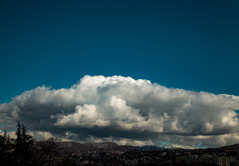 Fototapeta premium contrasting, white clouds floating in the blue sky on a Sunny day