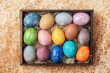 Different easter eggs with straw