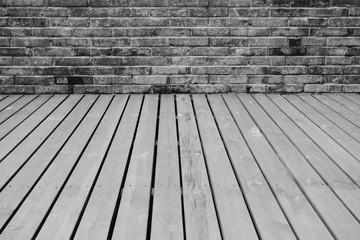 Black wood floor and black brick wall