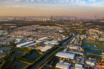 Aerial View of rural green fields in Hong Kong border and skylines in Shenzhen,China