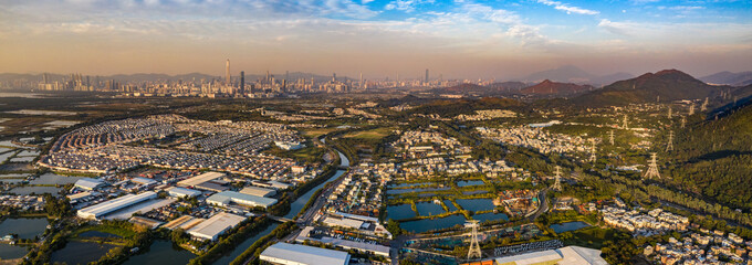 Aerial View of rural green fields in Hong Kong border and skylines in Shenzhen,China