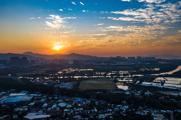 Aerial View of rural green fields in Hong Kong border and skylines in Shenzhen,China