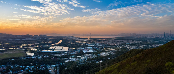 Aerial View of rural green fields in Hong Kong border and skylines in Shenzhen,China