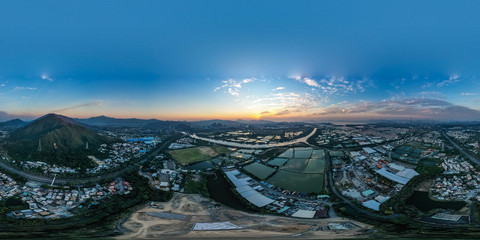 Aerial View of rural green fields in Hong Kong border at sunset