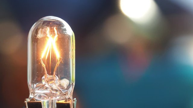 Close up Light bulb Turns On and Off, Incandescent lamp.