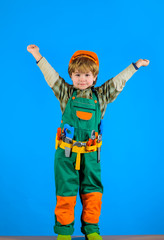 Worker with tools. Repair. Little boy in builder uniform with tools belt. Little kid repairman. Builder boy in helmet and toolbelt. Happy boy with tools for building. Child toys.