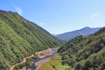 Fototapeta na wymiar View from Gvara fortress to the river Machakhlistskali, Georgia spring