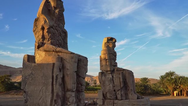The Colossi of Memnon, two stone massive statues of the Pharaoh Amenhotep III, who reigned in Egypt during the Dynasty XVIII.