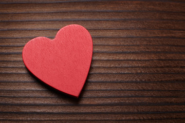 Red heart on wooden background. Valentine's day concept.