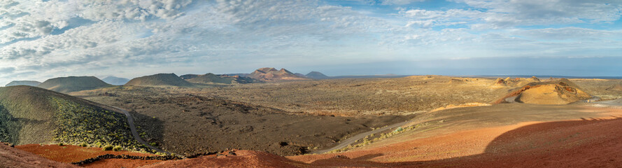 Fototapeta na wymiar Magnificent panoramic view of the Timanfaya volcanic park known as Mountains of Fire, Lanzarote, Canary Islands, Spain