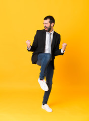Fototapeta na wymiar Full-length shot of business man over isolated yellow background