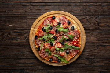 Stages of making pizza. Salami pizza