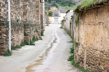Rural street in a town in western Spain on a rainy day