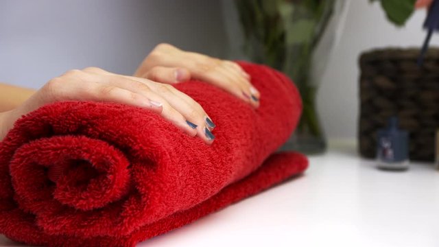 Manicure salon, Spa, nail painting on a red towel