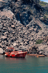 View on the Nea Kameni volcano island near Santorini island at sunny weather at Greece