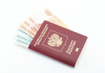 Russian Federation passport with invested money (rubles) on a high quality white isolated background.