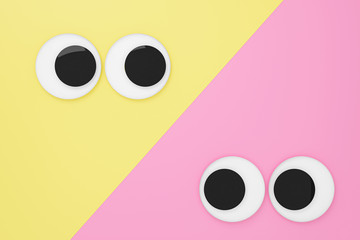 Cute googly eyes funny Isolated on yellow & pink pastel background , crazy kawaii eyes minimal idea creative concept & business ,banner, poster, cover, logo design template element.