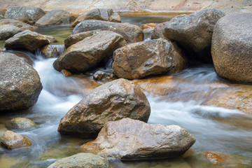 Fototapeta na wymiar Stones in the waterfall