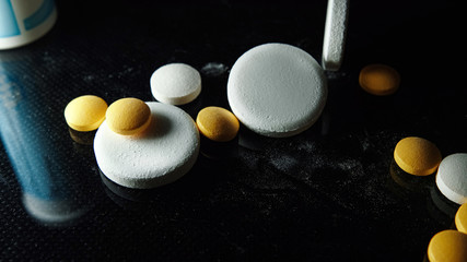 Medicine and Drugs. Many pills yellow tablets.