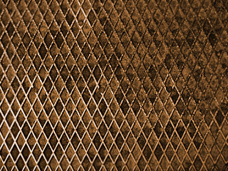 Metal grill in sepia closeup, background, texture
