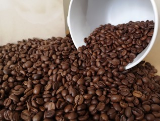 coffee beans coming out of the cup