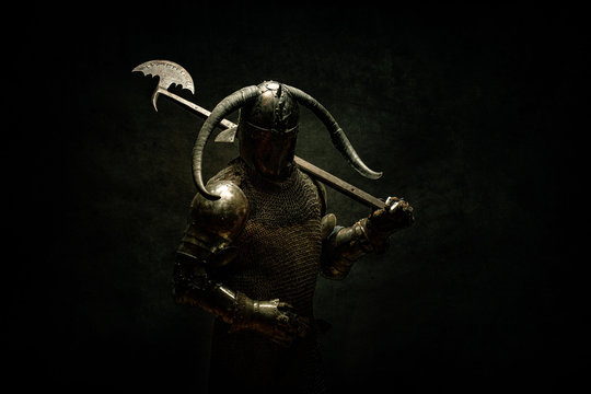 Portrait of a Viking Berserker warrior, holding a halberd on his shoulder