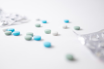 colourful medicine pills with hand. Coronavirus treatment concept