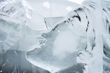 Abstract female face carved on the ice