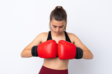Teenager sport girl over isolated white background with boxing gloves