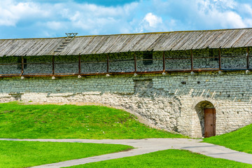 Fototapeta na wymiar Pskov, a door in the wall of Pskov Krom