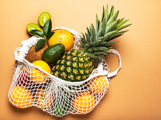Mesh shopping bag with fruits