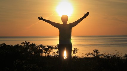 Fototapeta na wymiar silhouette of a man in a sunset
