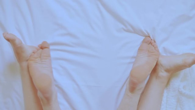 top view lovers in bed man and woman legs close up