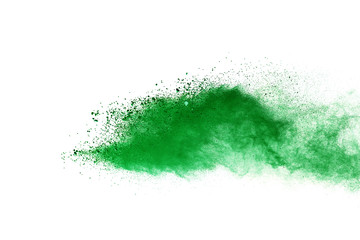Green powder explosion on white background.