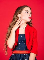 Hairdresser salon. Retro fashion. Movement towards vintage fashion. Little girl makeup face curly hairstyle vintage outfit. Fast fashion essentially business model companies that manufacture products