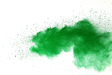 Green powder explosion on white background.