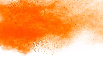 Fotobehang Abstract orange powder explosion. Closeup of orange dust particle splash isolated on white background. © piyaphong