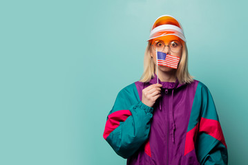 Beautiful woman in 90s sport suit in glasses with USA flag