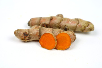 Turmeric root (curcuma) Turmeric extracted on a white background is used as an ingredient in turmeric foods. Turmeric helps to strengthen the skin.