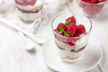 cheesecake with raspberries in glasses