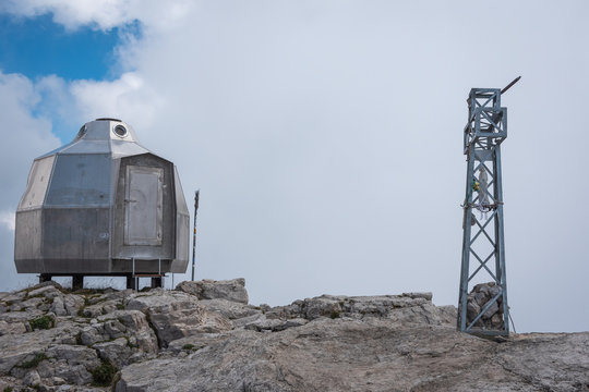 View of Grignetta Peak and a small UFO-shaped metal bivouac, Lombardia, Italy.