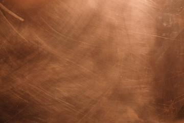 Copper background. There are scratches on the copper surface. - obrazy, fototapety, plakaty