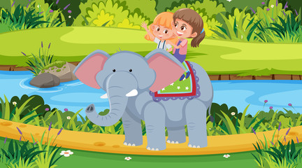 Scene with two girls riding elephant in the park