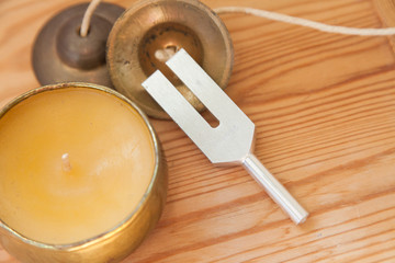 Hand holding a tuning fork .