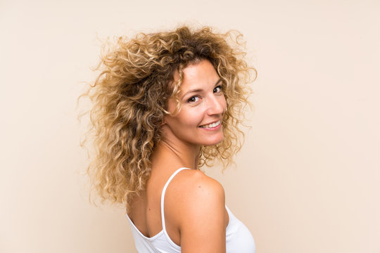 Young blonde woman with curly hair